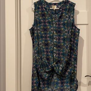 Floral sleeveless button down top